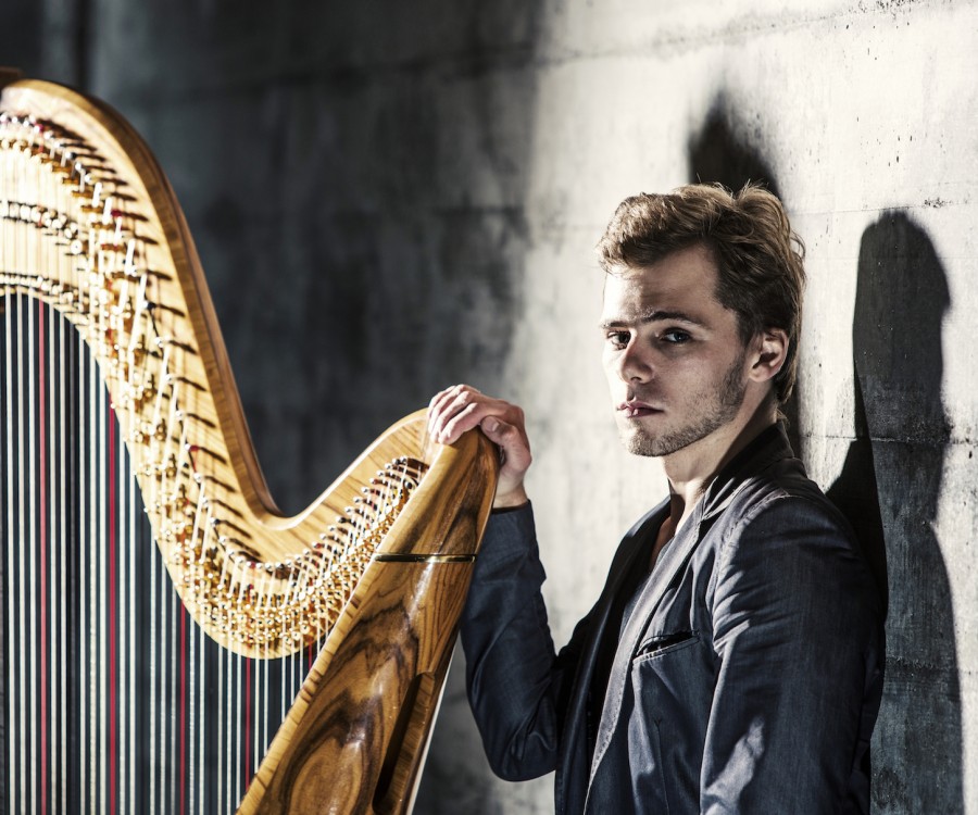 Alexander Boldachev stands by his harp.