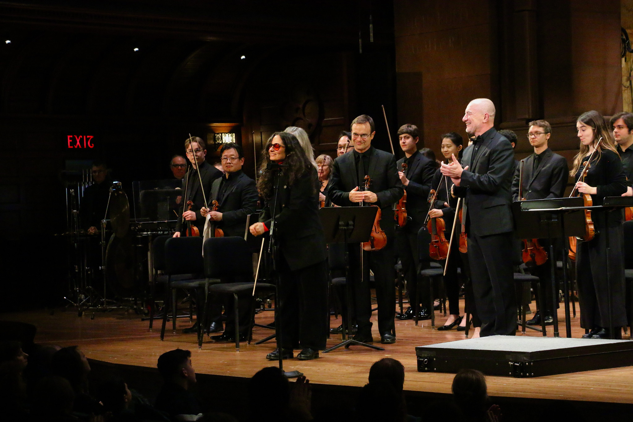 Andreia Pinto Correia standing on stage with the Princeton Symphony Orchestra