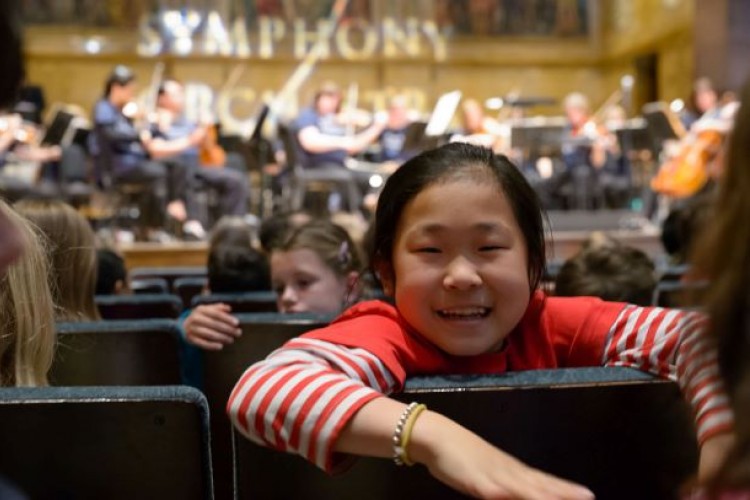 Young girl enjoying a concert