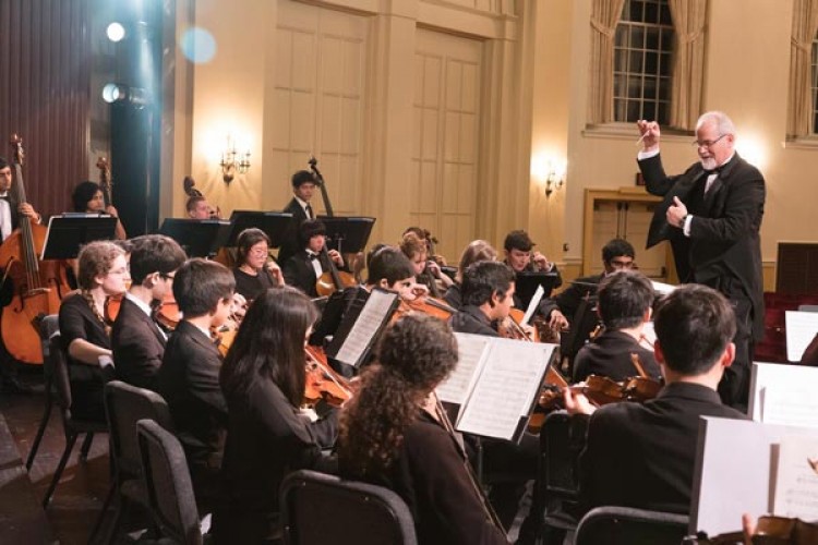 John Enz conducts students in YOCJ's Symphonic Orchestra