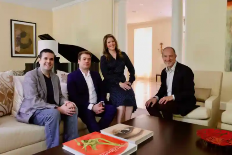 Princeton Festival Director Gregory Geehern, PSO Executive Director Marc Uys, PSO Board Chair Stephanie Wedeking, and Edward T. Cone Music Director Rossen Milanov seated on a sofa and chairs and smiling at the camera