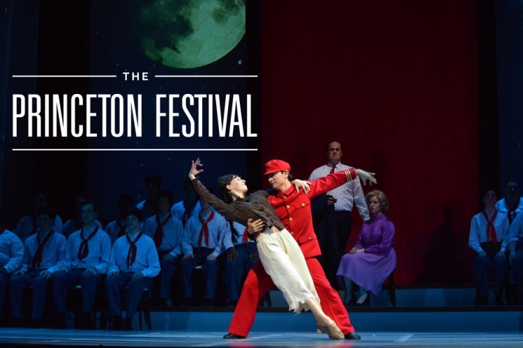 Two performers striking a dance pose on stage.